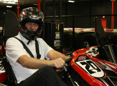 Bruce Clay driving a go-kart.