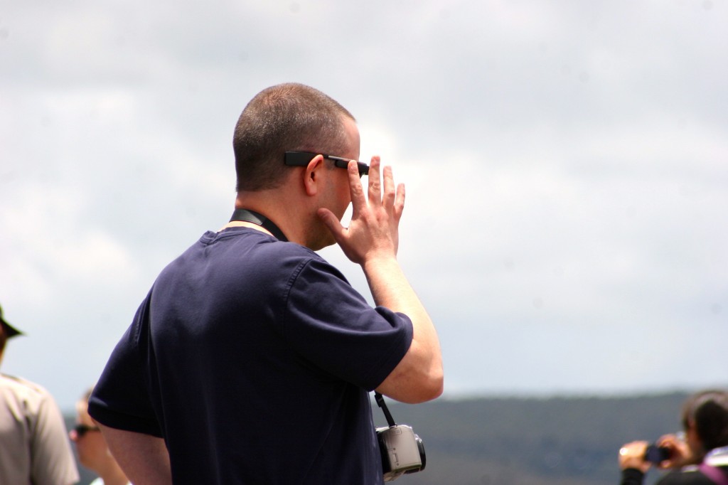 Profile of Matt McGee as he taps his Google Glass. 