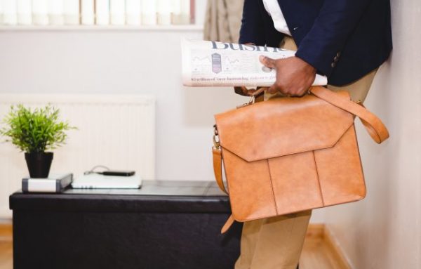 newspaper and briefcase 