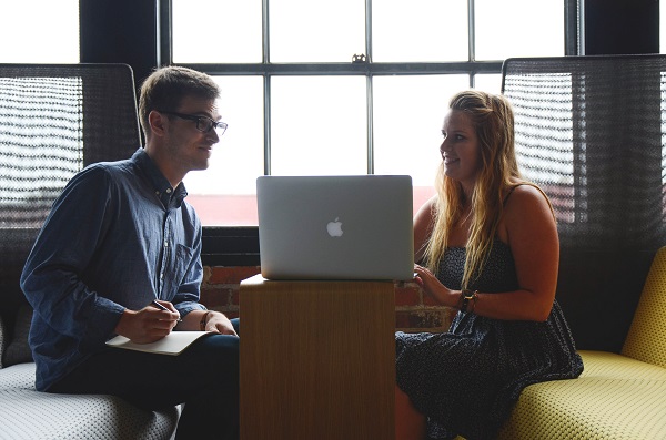 man and woman at laptop