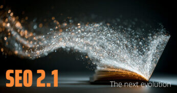 laptop emanating sparkling light and digital energy illuminating the open pages of a book. Text overlay: SEO 2.1, the next evolution.