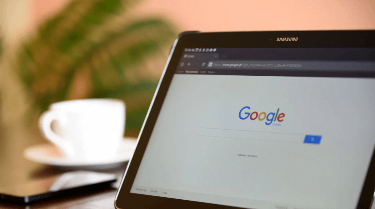 Tablet displaying Google search homepage on a desk, representing search behavior and AI-driven search changes.