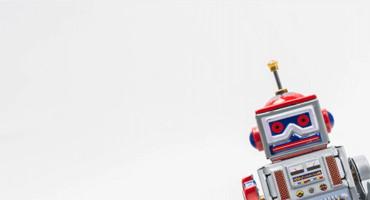 Vintage toy robot isolated on white background representing search engine crawl issues and indexing problems