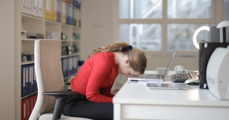 Woman face plants on keyboard.