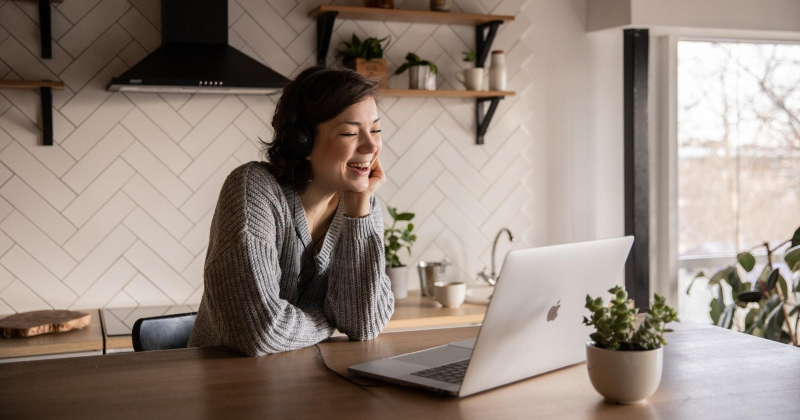 Woman smiling at plugin feature.