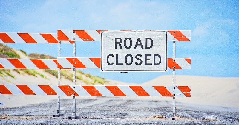 Road closure symbolizes SEO project block.