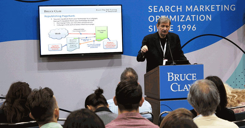 Bruce Clay gives expert SEO training in front of a conference audience.