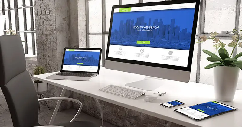 Modern website design displayed on desktop, laptop, tablet and mobile device.