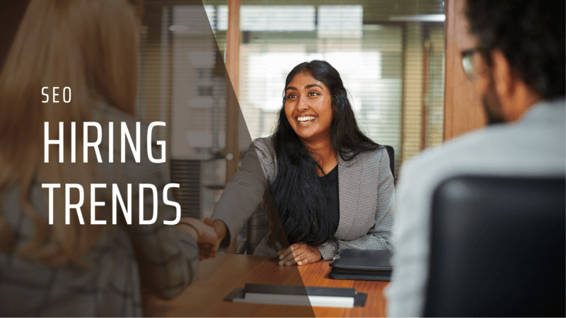 SEO hiring trends graphic overlay showing a candidate shaking hands with an interviewer, used to highlight current SEO job market insights.