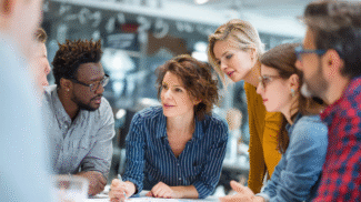 Marketing and SEO professionals collaborating around a table, discussing strategy and data in a modern office environment.