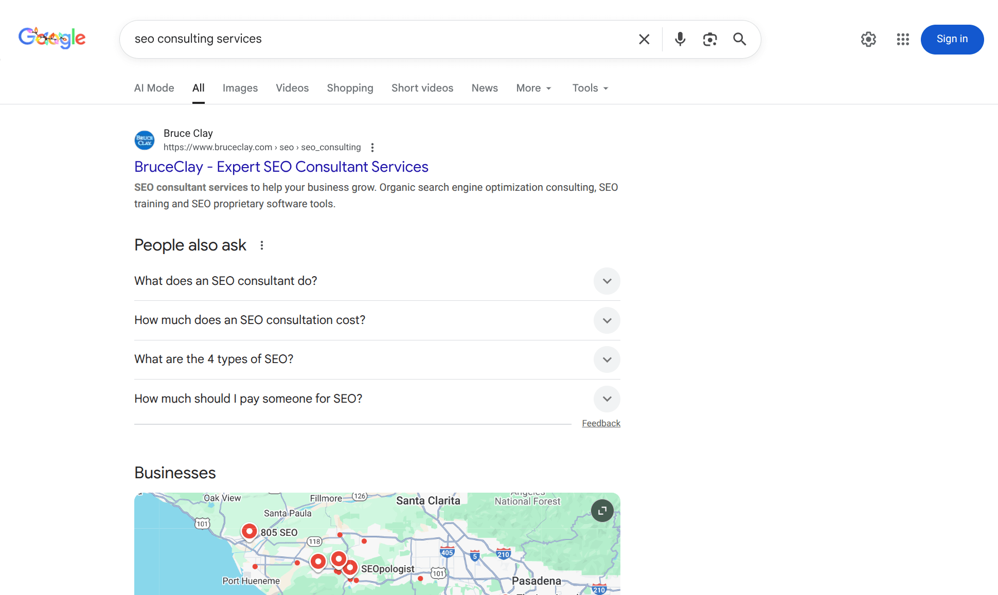 Google search results page for ‘SEO consulting services’ showing Bruce Clay ranked at the top with a People Also Ask section and a local businesses map below.
