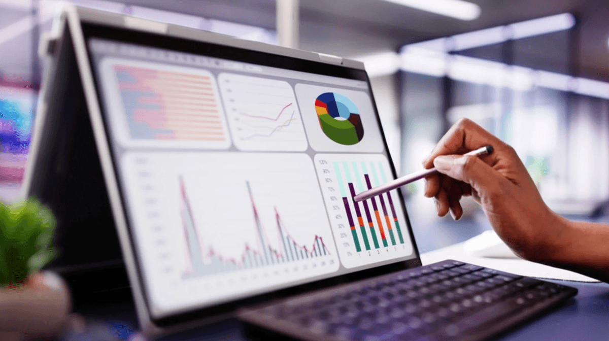 A laptop screen with reports on it.