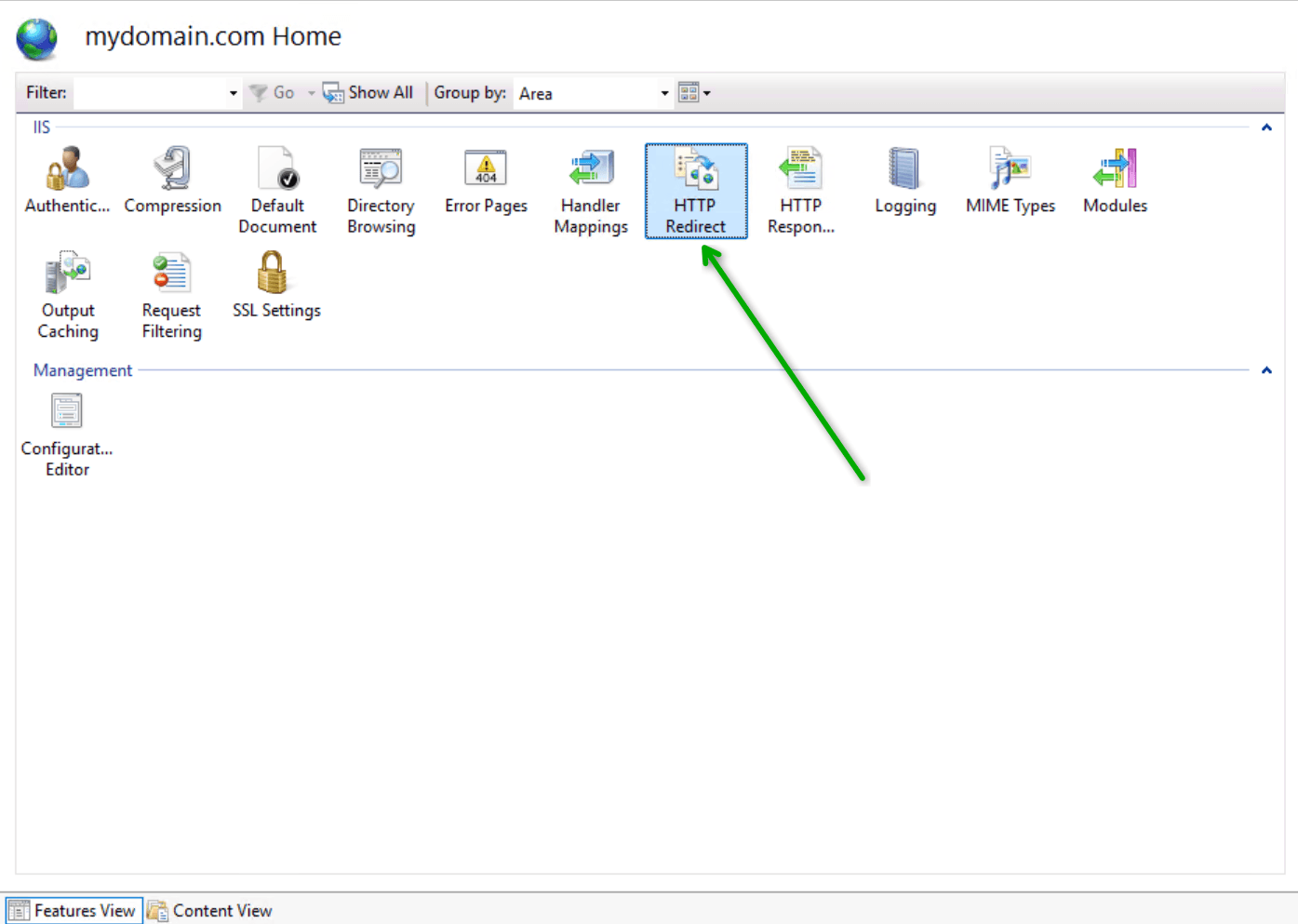 The features view dashboard inside IIS Manager for a domain home screen. A bright green arrow points directly to the "HTTP Redirect" management icon among other server configuration tools.